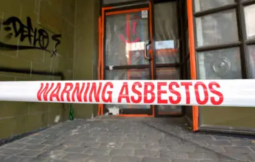 Warning asbestos tape at construction site